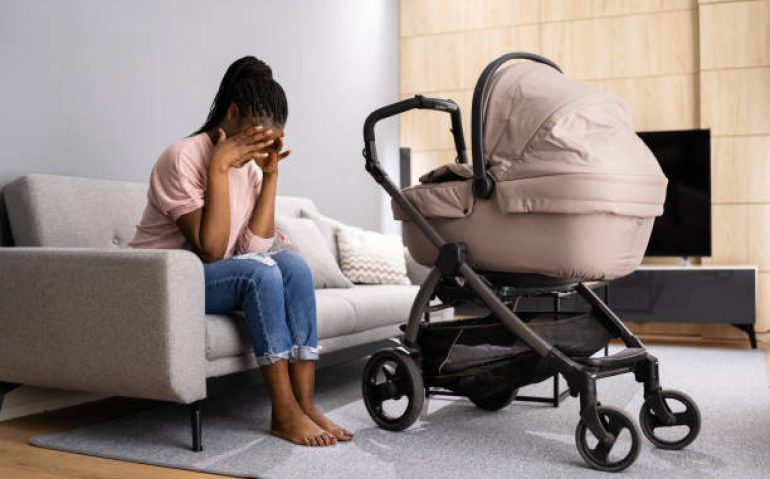 Depressed Unhappy African American Woman With Newborn. Frustrated Mum